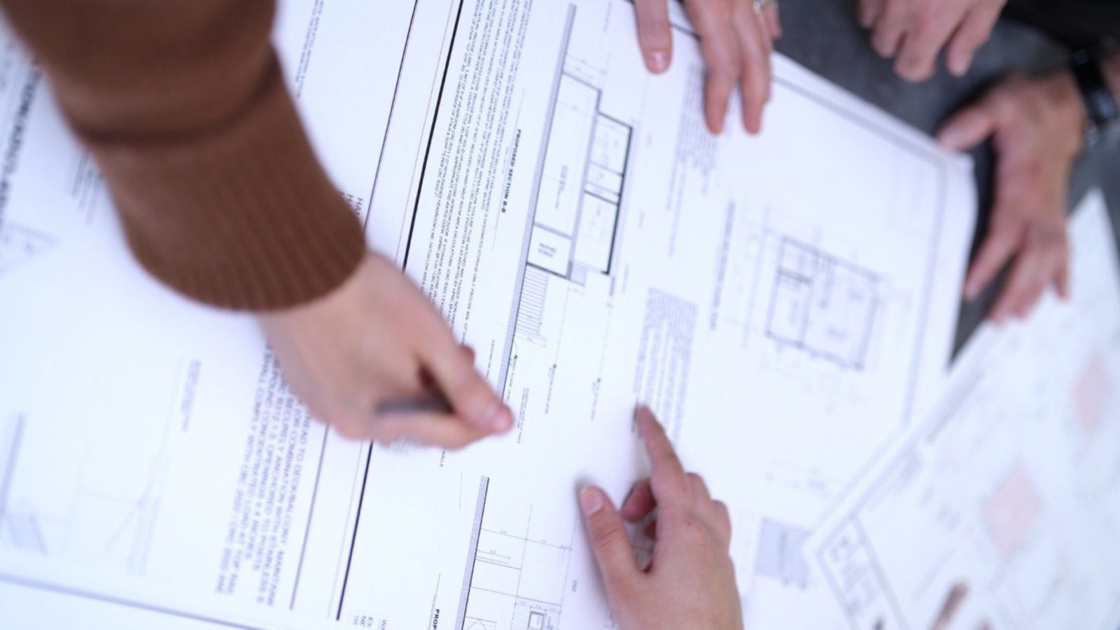 Fast Build engineer reviewing stamped structural drawings for a San Diego permit